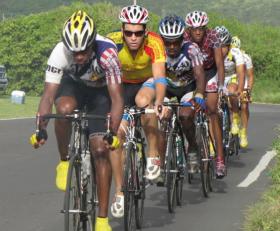 Racers work in a pack on North Shore Road Sunday. Racers work in a pack on North Shore Road Sunday.